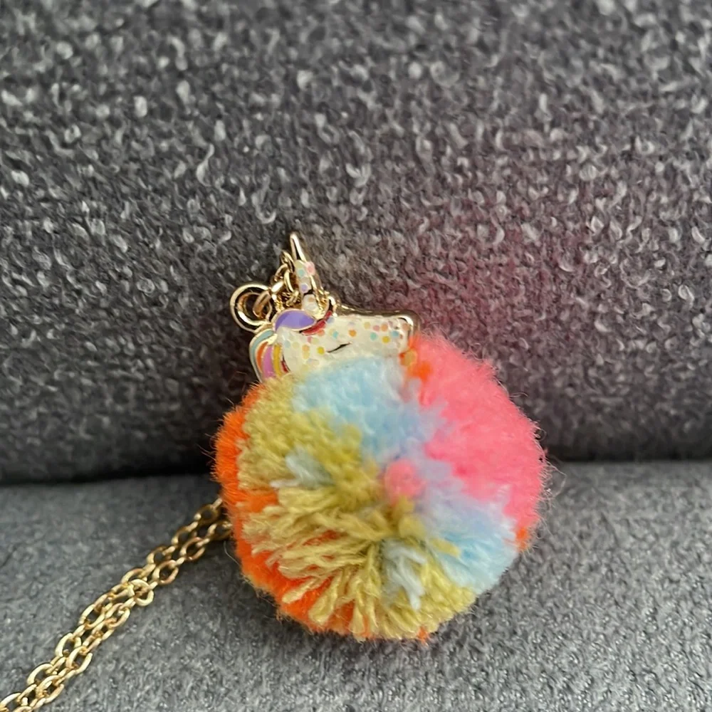 Claire’s Rainbow Unicorn PomPom Necklace